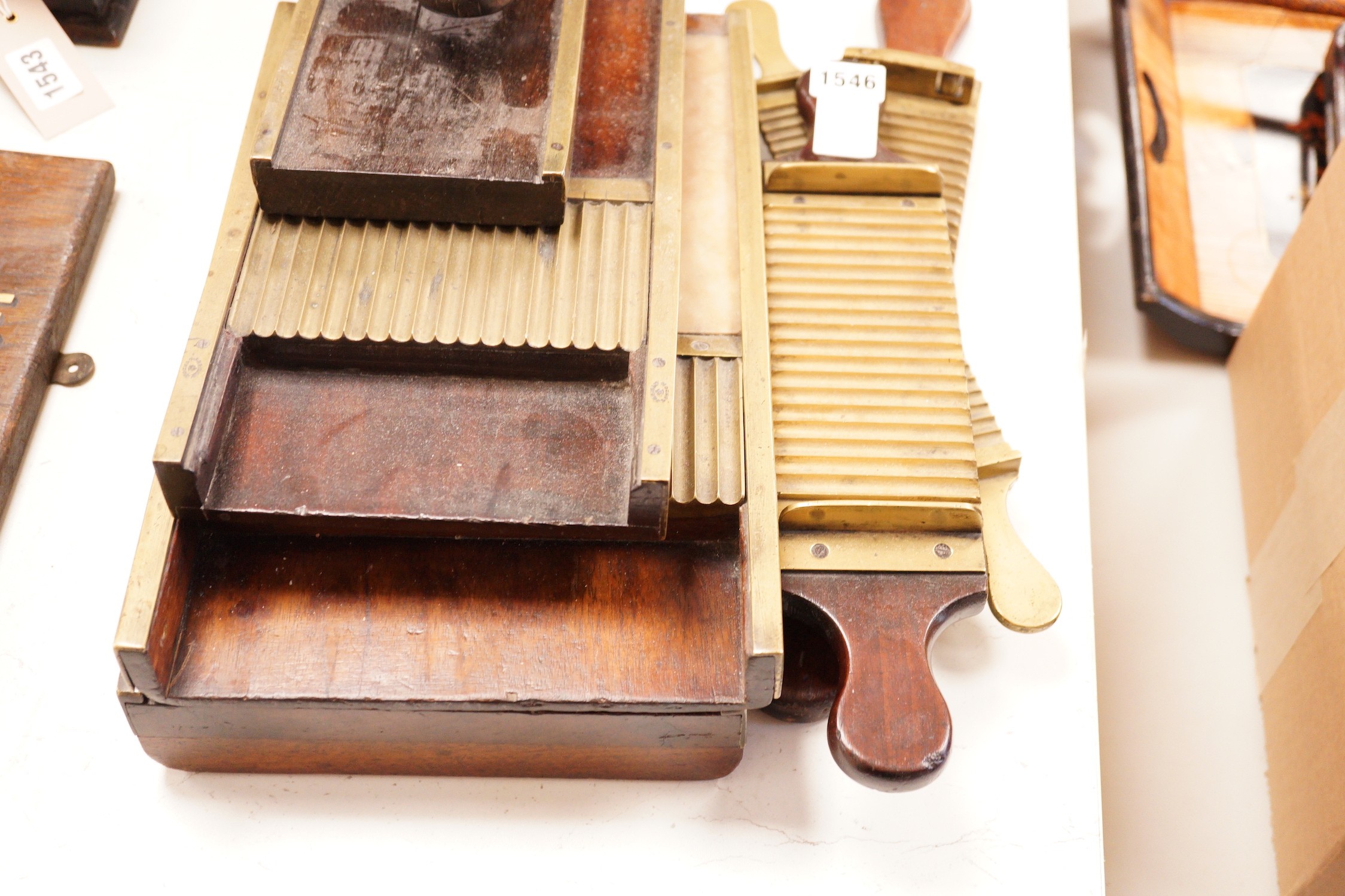 A collection of 19th century brass and mahogany chemist’s pill press rollers, Drury Lane marked examples etc